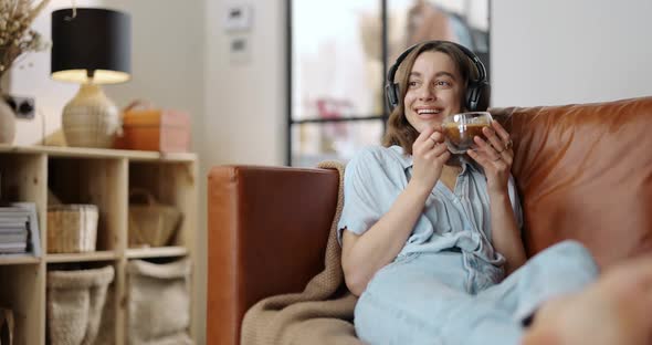 Woman Enjoying Music and Coffee at Home