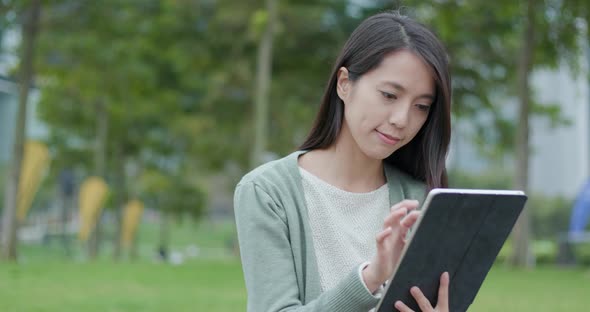 Woman use of tablet computer in the city