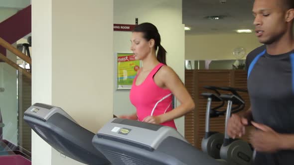 Group running on treadmills, cardio workout exercise in gym