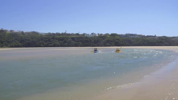 Canoes going by at Nahoon River, South Africa.