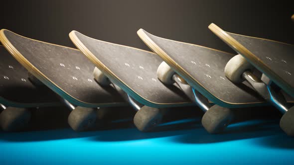 An endless row of overlapping skateboards stacked together in studio light. 4KHD