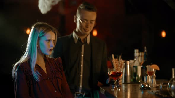 Young Woman Sitting By the Bartender Stand - a Man Comes To Her and Hug Her - Meeting a Girl