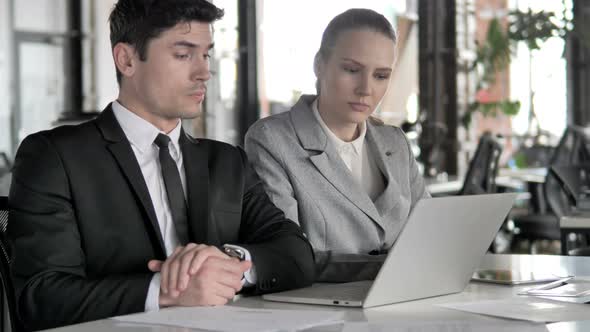 Businessman Discussing Work with Partner