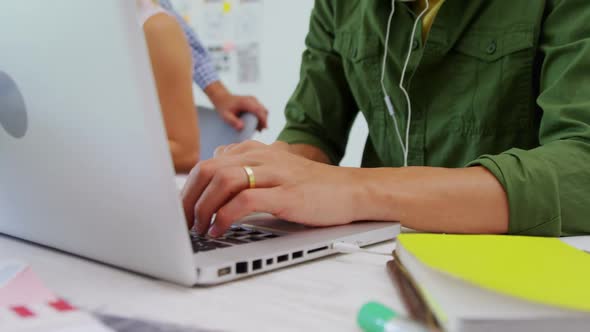 Attentive executive using laptop at desk 4k