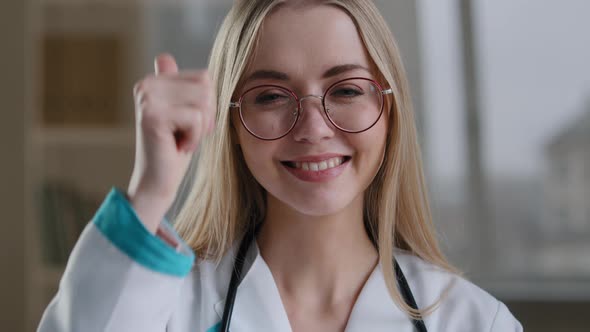 Caucasian Smiling Happy Millennial Woman Doctor in Glasses Nurse Orthodontist Looking at Camera