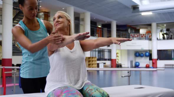 Woman exercising with a prosthetic leg