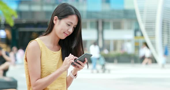 Woman Use of Mobile Phone in City