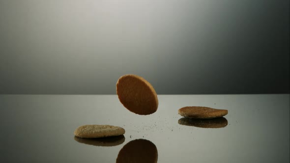 Cookies falling and bouncing in ultra slow motion 1500fps - reflective surface - COOKIES PHANTOM 040