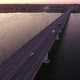 Aerial Shot of a Lanky Bridge Over the Dnipro at a Dreamy Sunset in Summer - VideoHive Item for Sale