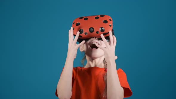 Girl with Modern Virtual Reality Goggles Scared