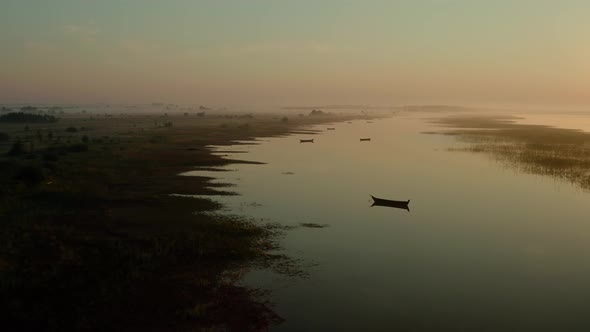 Aerial Drone View, Drone Flies Forward Slowly Towards, Boat on the Sunrise, Morning Fishing