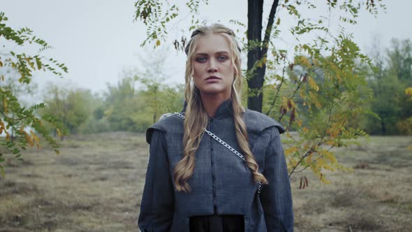 Portrait of a Young Woman in Gray Clothes Walking in the Forest, Medieval