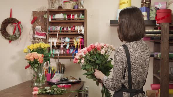 Beautiful Female Florist Working Indoor