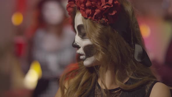 Woman in Halloween Costume Posing for Camera