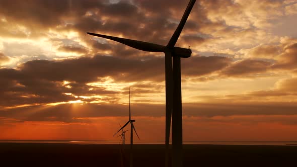 Wind Machines Built at Ecofriendly Station Rotate at Sunset