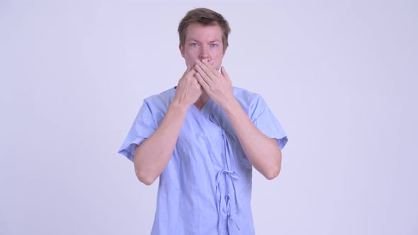 Young Man Patient Showing Speak No Evil Concept