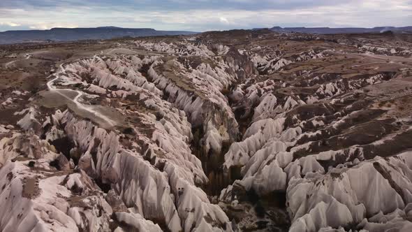 Aerial Drone Landscape of the Volcanic Rock Forming Narrow Gorge Filmed at Summer Day