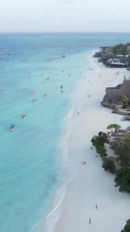 Vertical Video Boats in the Ocean Near the Coast of Zanzibar Tanzania