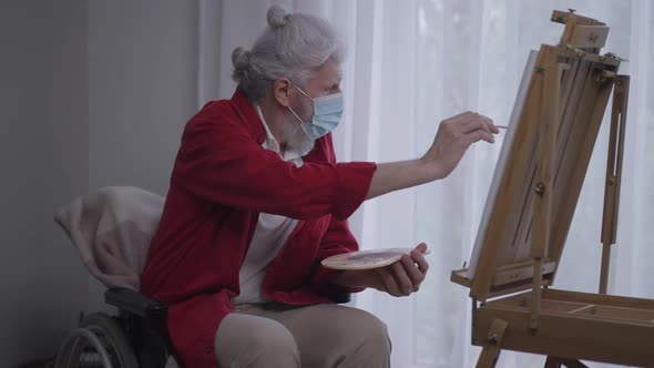 Old Disabled Creative Artist Painting on Easel Looking Out the Window