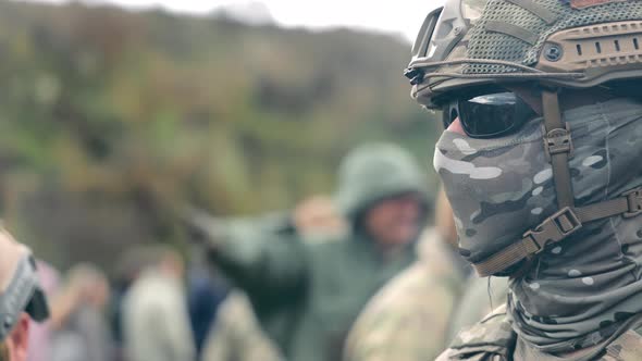 Military Man Hiding His Face with a Mask