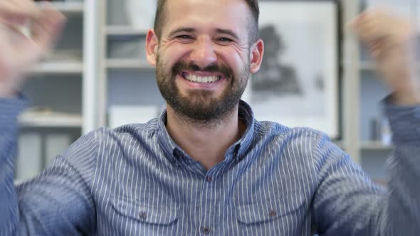 Adult Man Celebrating Success  Gesture in Office