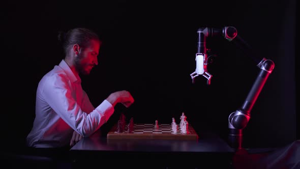 Man Playing Chess with a Robot the Confrontation Between Man and Artificial Intelligence Futuristic