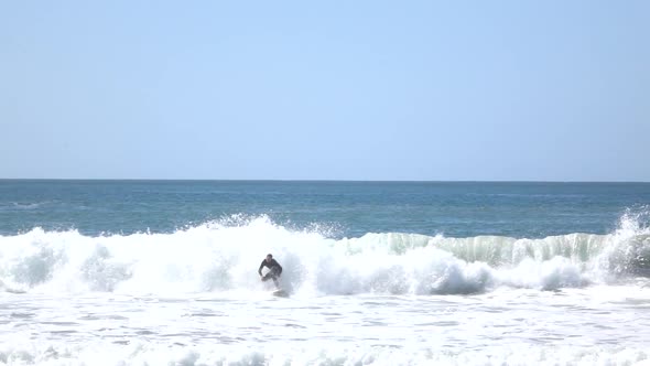 Surfer Carving The Wave