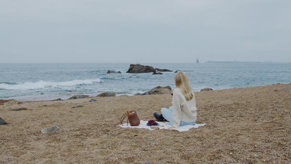 Young Woman Is Relaxing On Beach