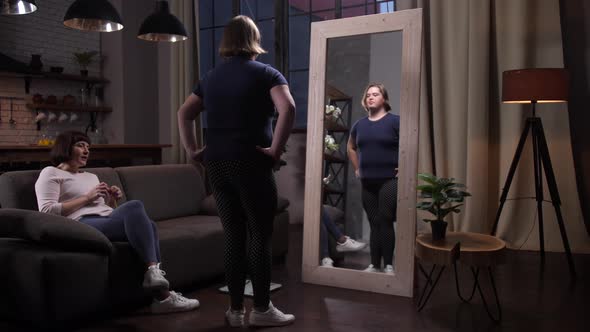 Curvy Girl with Down Syndrome Looking at Mirror