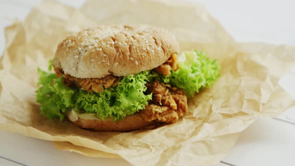 Chicken Burger Lying on Parchment