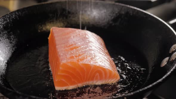 Grilled Salmon Fish with Various Vegetables on Pan on the Flaming Grill