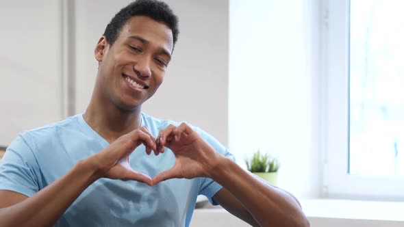 Heart Sign by Young Black Man