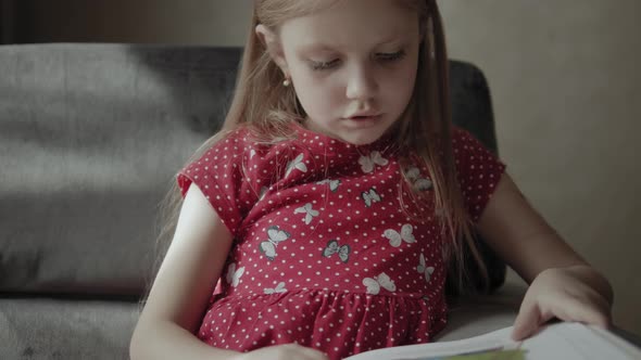 Six Years Old Girl Reads Book