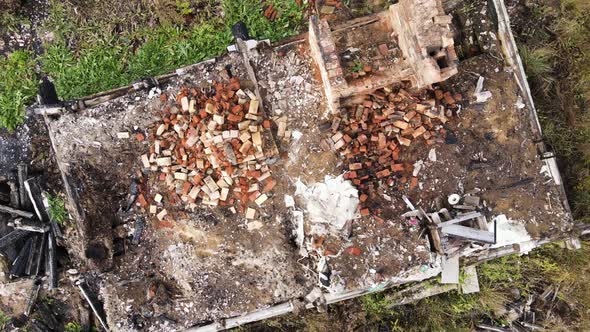 Burnt House with a Chimney Sticking Out of the Ruins Aerial View