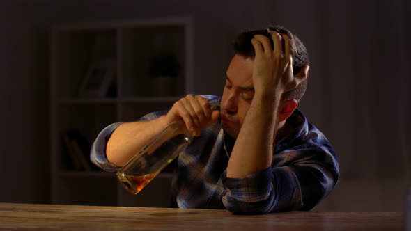 Alcoholic Drinking Whiskey From Bottle at Night 59