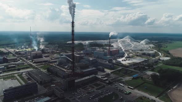 Mining and Processing Plant, View of Pipes and Smoke, Mineral Piles, Mountains of Minerlas and Sand