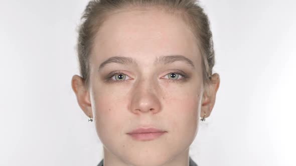 Close Up of Serious Casual Young Woman Face White Background