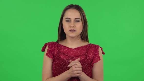 Portrait of Tender Girl in Red Dress Is Standing Worrying in Expectation Then Smiles with Relief