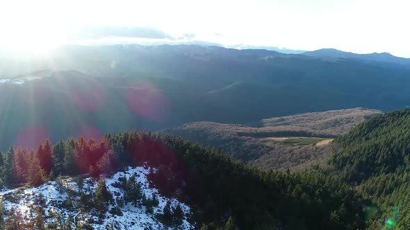 Flying Over Mountain With Sunny Day