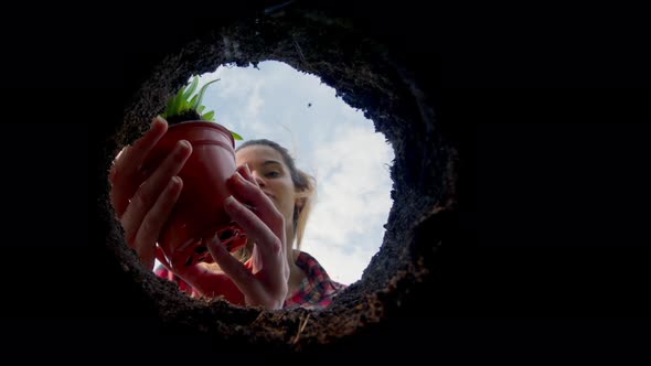 Female Gardener Planting