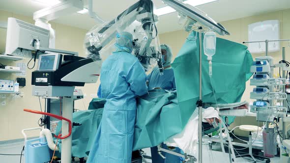 Surgeons are Using a Microscopic Device During Operation