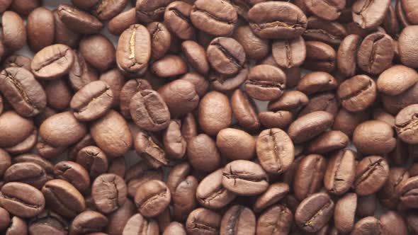 Top View of Fresh Coffee Beans on White Background with Copy Space