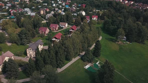 Aerial View of Green Fields and Houses in the Countryside