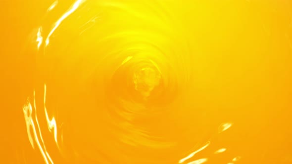 Super Slow Motion Shot of Orange Juice Whirl at 1000 Fps