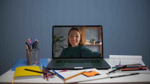 A Young Woman is Talking Through a Video Call