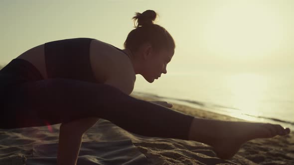 Proffesional Yoga Woman Leaning on Hands Firefly Position at Sunset Close Up