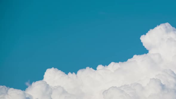 Timelapse of White Puffy Cumulus Clouds Forming on Summer Blue Sky