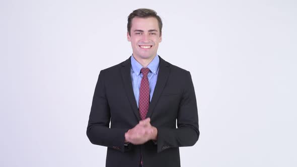 Young Happy Handsome Businessman Clapping Hands