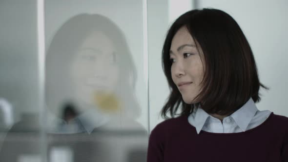 Portrait of Japanese business woman in office