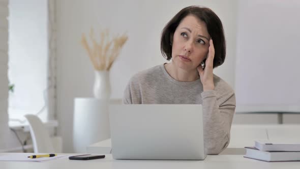 Headache Tense Old Woman Working on Laptop